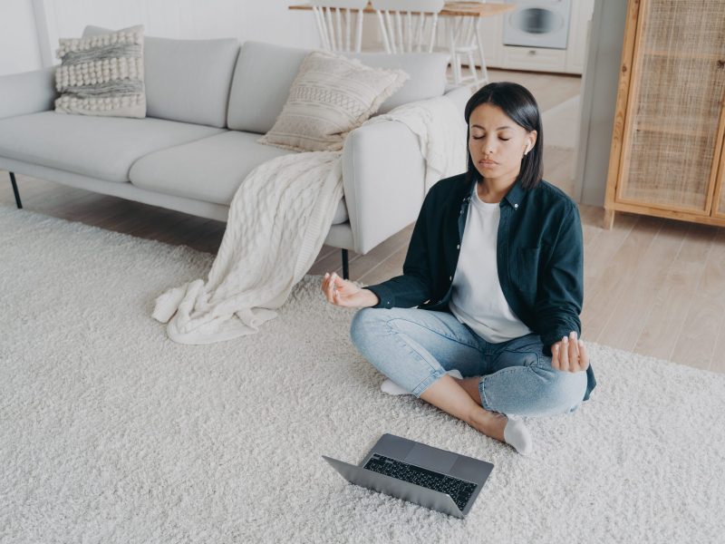 Female practices yoga at laptop on the floor, listening meditation to relieve stress after work at home. Calm woman in earphones meditates sitting in lotus pose in front of computer. Healthy lifestyle SSUCv3H4sIAAAAAAAAA3VQwW7CMAz9F59braXtWPoF7IC02w5oBzcxYJEmKEmHJtR/nwNl22U++fn52c++AhvoodVdu26xKle4V2VdkynVSqlybbTaG1LDUA9QgMFE0NdNU71UnWq77rlZVRIFDBhZQ38FtnaKKWBi76AXJpAzFG4pGU4+MFpBcwExYZoiRZEJ0jL7IOwNP+btrrkuBt/Iny2JhTgNAt/9SA7m4kG/ukSBfYg/HVuOmqxFR36Kfzo3hDYdNQZ62oofLWb+kXwUgAdy+iv7m/MhlvBmdyfU6SIbx8W7T8d8Yk7PgTW7w3KTvMKP99z5lLWQ1yWvT2wW8f0NR5ZqyLtgOluPhsxCT8PIKT1goE+my2/3PM/f4fCyd8QBAAA=